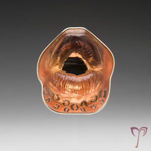 Created in 2011, AEIOU and Sometimes Y is a brooch that further explores the nuances of language. Source.